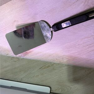 Sleek Stainless Steel Spatula with Black Handle
